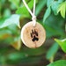Wolf Paw Print Pendant with Runes.