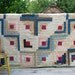 vintage antique quilt brown blue and cream white old hand quilted calico prints log cabin