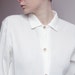 Long white blocks blouse