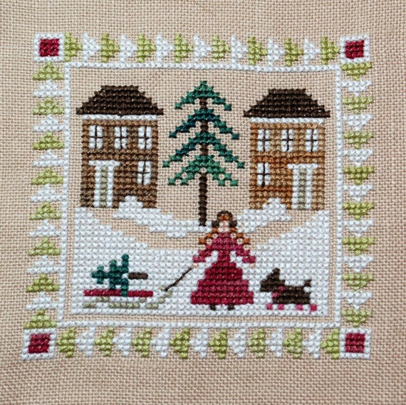 Finished Cross Stitch Christmas Ornament Bringing Home