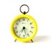 Vintage alarm clock West German solar power yellow brass Made in Germany Mid-Century 60s 70s