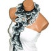 The scarf is knitted with gray multicolor soft yarn. Long scarf. Romantic. For her. HAND MADE.