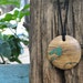 Pendant of malachite and olivewood