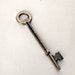 Vintage Metal Medium Sized Key with 8 Pressed into it
