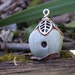 Gilded Birdhouse- polymer clay charm. grey green rounded square pendant. silver bead cap leaf roof. rustic cottage. Jettabugjewelry