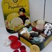 Vintage buttons 1/4 pound buttons in a vintage Le Bonbon Tin