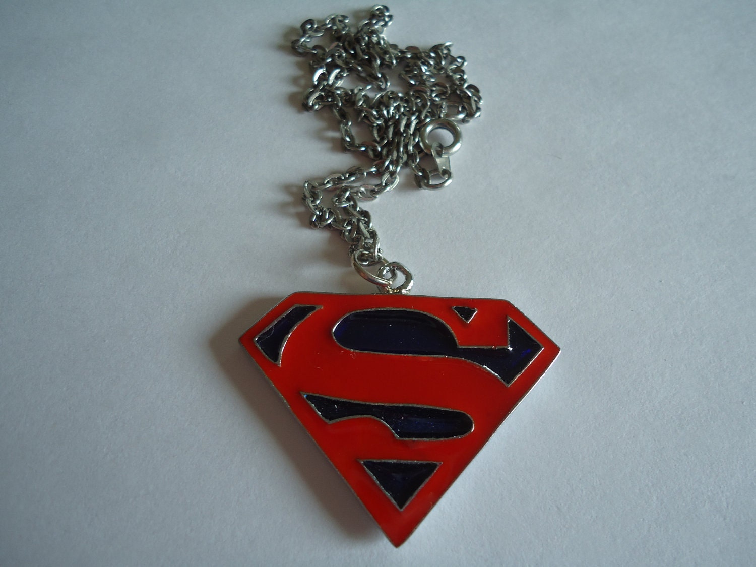 Items similar to Superman necklace on Etsy