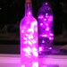 Frosted Clear Wine Bottle Light with pink LED lights inside - battery operated