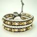 Brown freshwater pearl wrap thread leather bracelet.