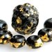 reserve for Julie Lampwork graduated bead set of 7 beads in 23k Italian gold on deep black glass