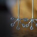 Hoop earrings with flower. Recycled sterling silver