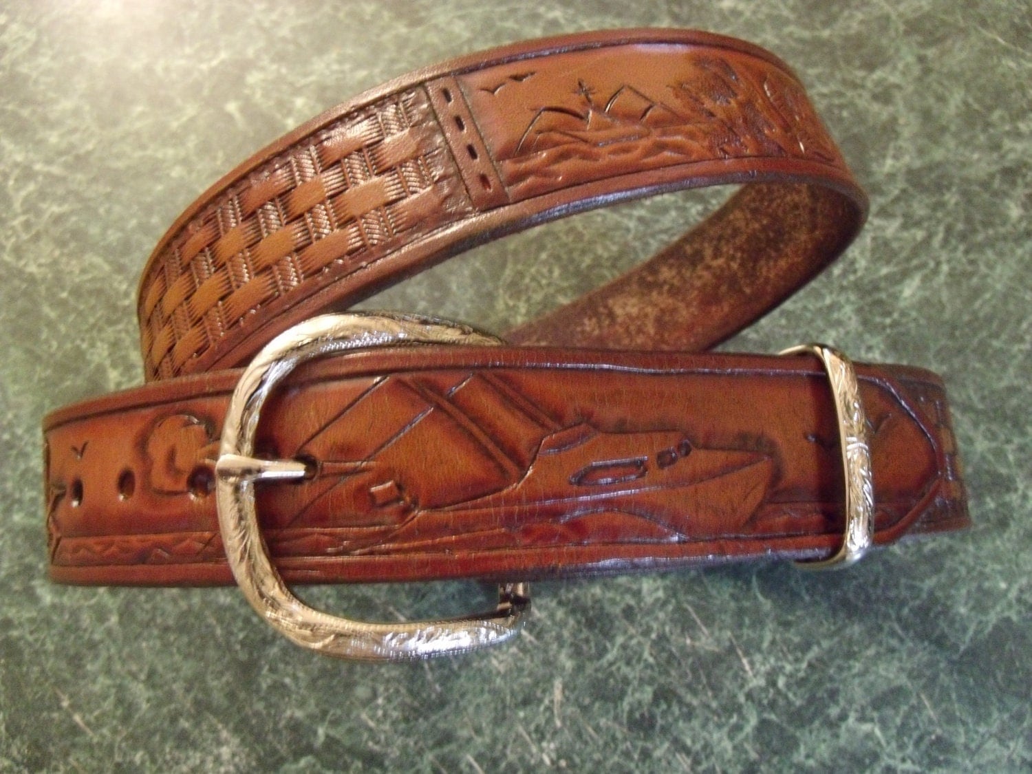 Hand tooled leather belt. Salt water fish theme with boats and