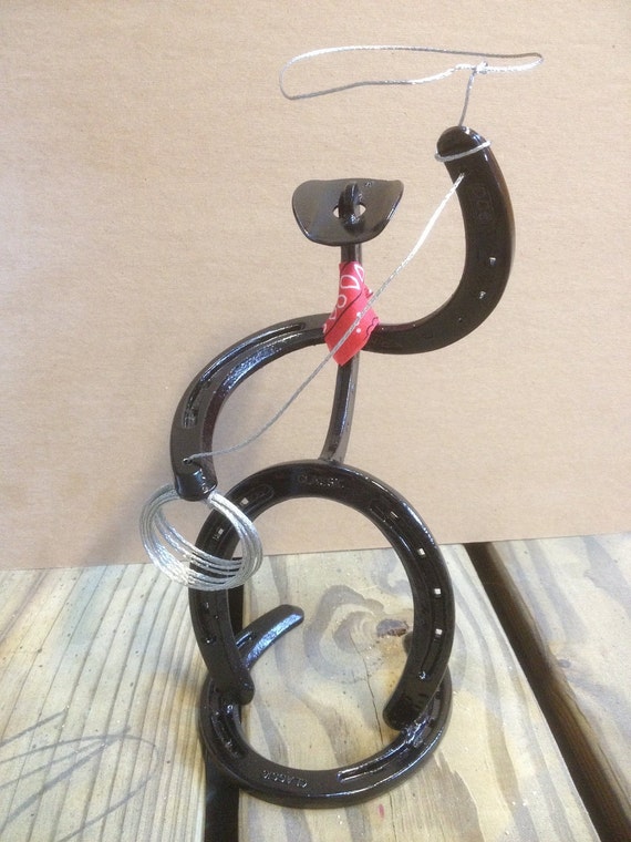 Items similar to Cowboy made from horseshoes with lasso and bandana on Etsy