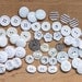 Collection of 48 Vintage, White and Off White, Plastic Shank and Flat Buttons, Various Shapes, Sizes, Textures and Designs. Item 0365