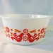 Vintage Pyrex 'Friendship' oven dish with red and orange birds and flowers