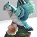 Lovely Figural Bluejay Bird With Wings Outstretched and Delicate Flower at Feet Figurine