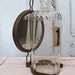 Old glass bottle antique mirrored reflector with clamp industrial farmhouse styles anita spero