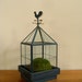 Beautiful glass and painted metal cupola-like terrarium with rooster weathervane.