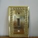 Solid brass switch plate with Greek key border