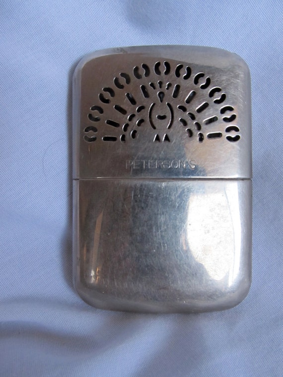 Vintage pocket warmer with peacock design