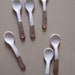 set of spoons in brown earthenware