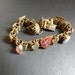 Antique French Art Deco Bracelet with Enameled Shields and Prong Set Semi Precious Stones, French possibly