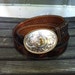 Vintage "J" Montana Silversmith silver plated belt buckle on a Western hand tooled leather belt