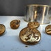 Golden coloured army jacket buttons