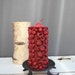 Old, unused candle with fruity decor