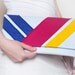 RESERVED Mod white felt clutch with bright stripes