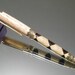 Wood Pen: light checker and circle harlequin wood pen in sculptured gold setting