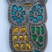 Groovy vintage cast iron owl with metalic stained glass in emerald green saphire blue and gold yellow