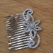 Beautiful silver color hair comb with sparkling rhinestones