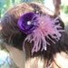 Very cute purple color flower with feather and beads