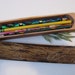 Log pencil box made from one length of dead standing juniper wood.