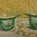 Two unique and heavy VTG candle holders (light green glass)