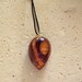 Hand Carved Wood avocado seed pendant - Deep Cuts Design