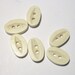 6 Vintage 1960s White Oval Buttons