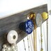 Jewelry Organizer with Blue, Yellow, and Grey Knobs