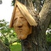 Unique cedar wood birdhouse, hand carved face with a surprise entry