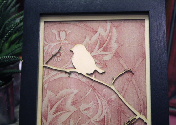 Laser cutted bird on branch with vintage wallpaper by madebymanos