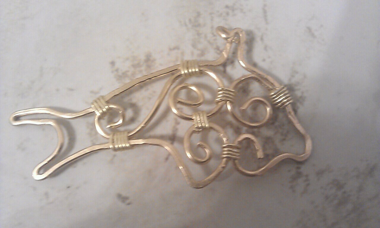 Wire wrapped brass dolphin pendant