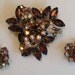 Vintage rhinestone brooch and earrings are a throw back to Mad Men era jewelry.