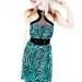 Agoraphobix Fishnet Fashionista fishnet racer back and turquoise zebra print mini dress