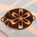 Embossed Brass Daisy Oval Connector E26