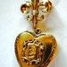 gold heart locket with fleur de lis pin locket 1950s