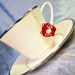 IOU red acrylic apple necklace Sherlock & Moriarty inspired