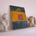 Abstract painting on canvas, heavily textured, bright primary colors, modern urban apartment minimalist decor