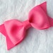 Shocking pink hair bow clip