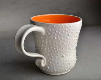Dottie Mug: MADE TO ORDER One White Coffee Mug Cup With Orange Interior by Symmetrical Pottery